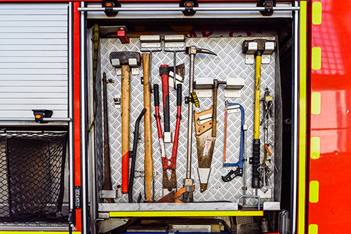 Fire truck open comparrtment showing tools